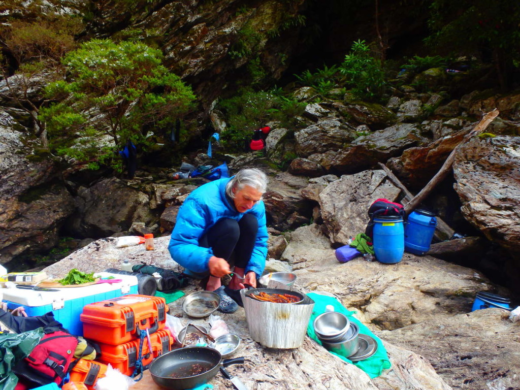 Brett cooking breakfast in the Great Ravine - at Water by Nature Tasmania, Franklin River Rafting™