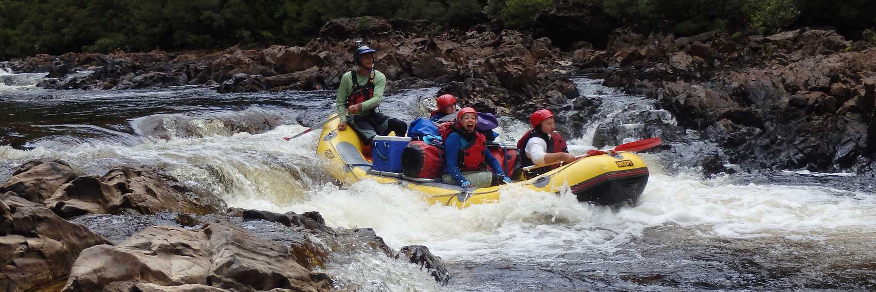 Brett and crew running a rapid on the upper Franklin River running a 