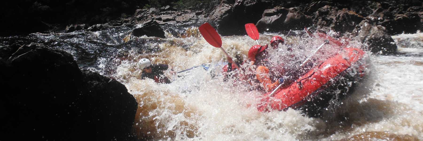 raft submerged in whitewater at Trojans rapid on the Franklin River